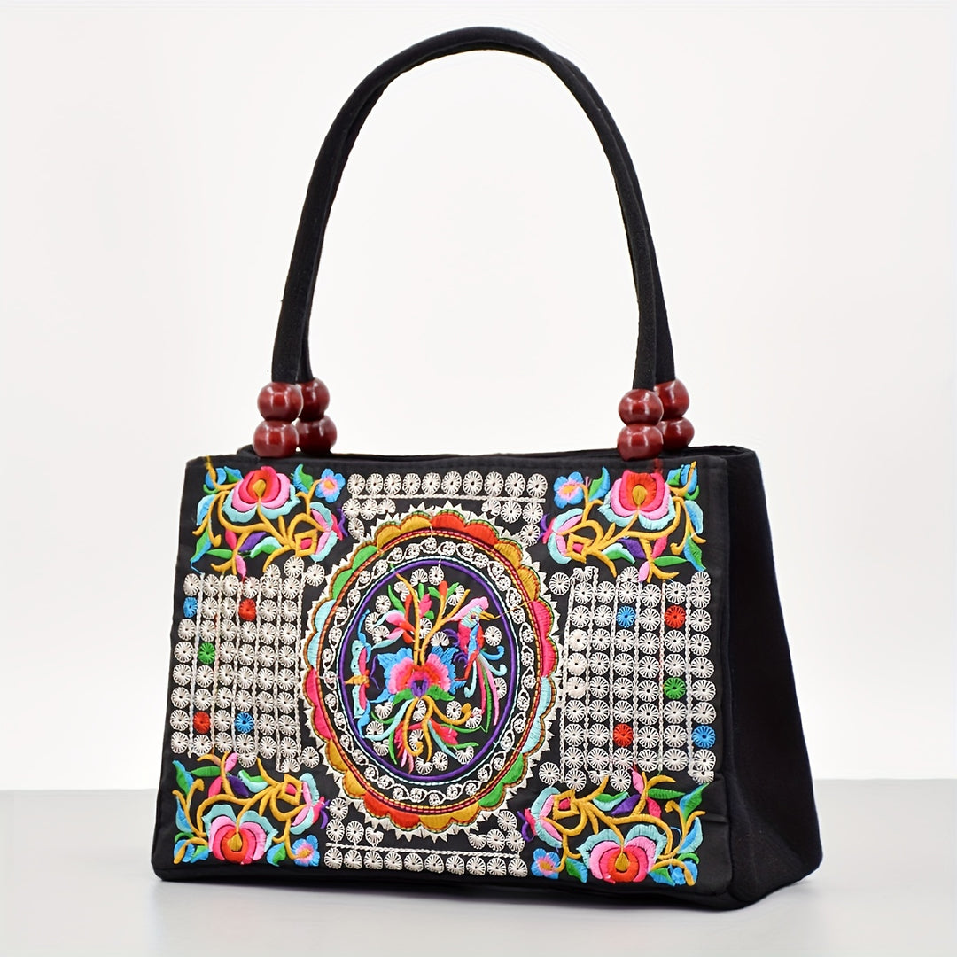 Decorative handbag with colorful embroidery and beadwork on a white background