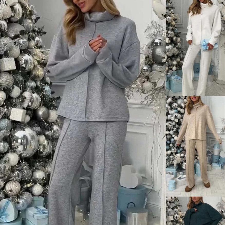 Woman in different color outfits standing in a room with decorative Christmas tree and presents.
