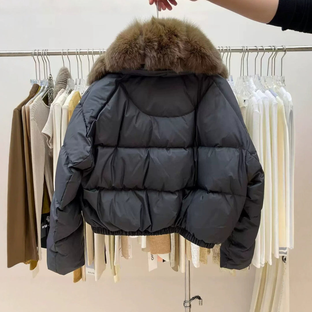 Back View Of Black Women's Cropped Puffer Coat With Brown Fur Collar
