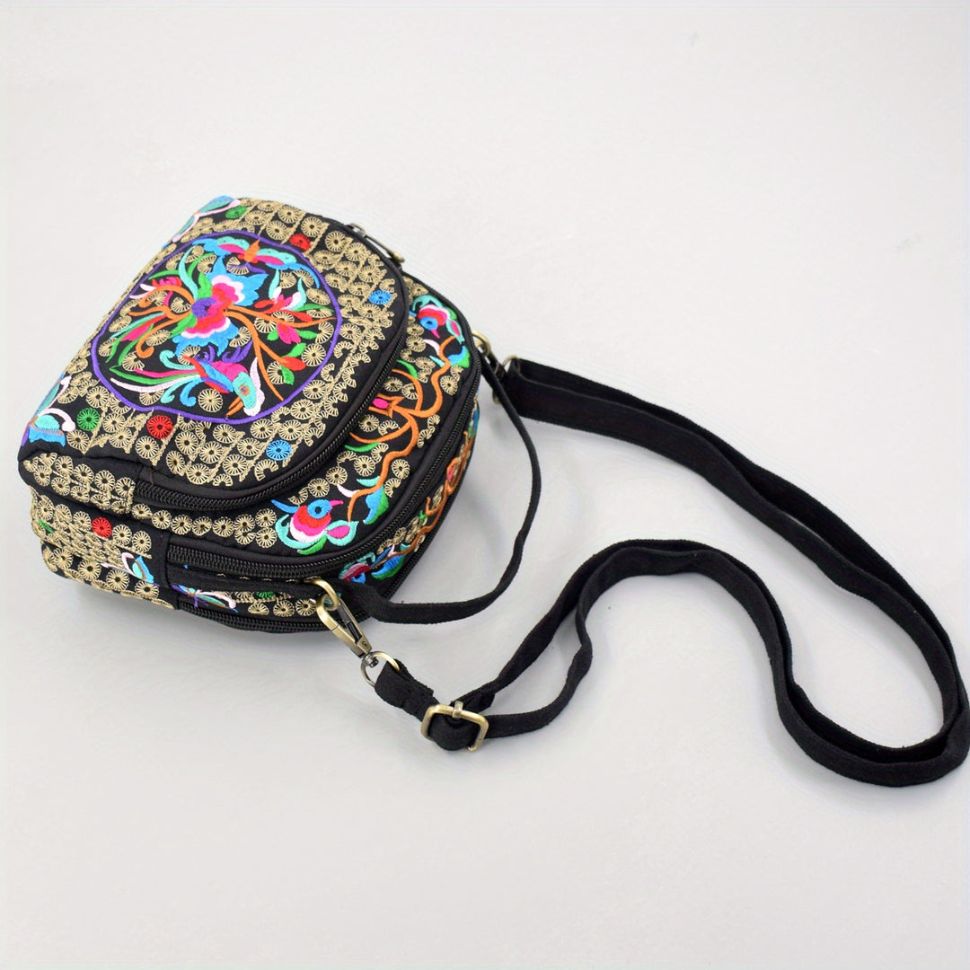 Decorative handbag with colorful patterns and a black strap on a white background