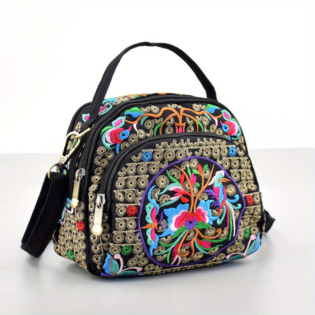 Colorful embroidered handbag with intricate designs on a white background
