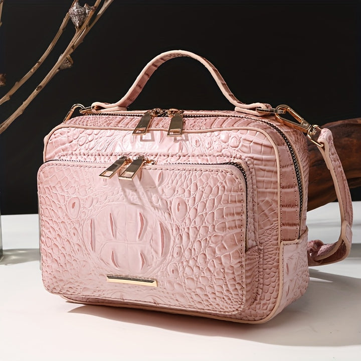 Pink textured handbag with gold accents on a white surface