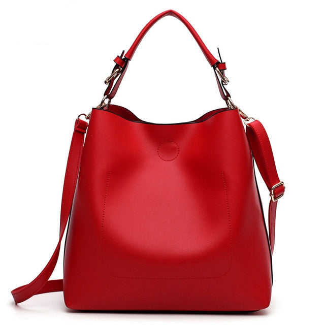 Red leather-look shoulder hobo bag with top handles and adjustable crossbody strap