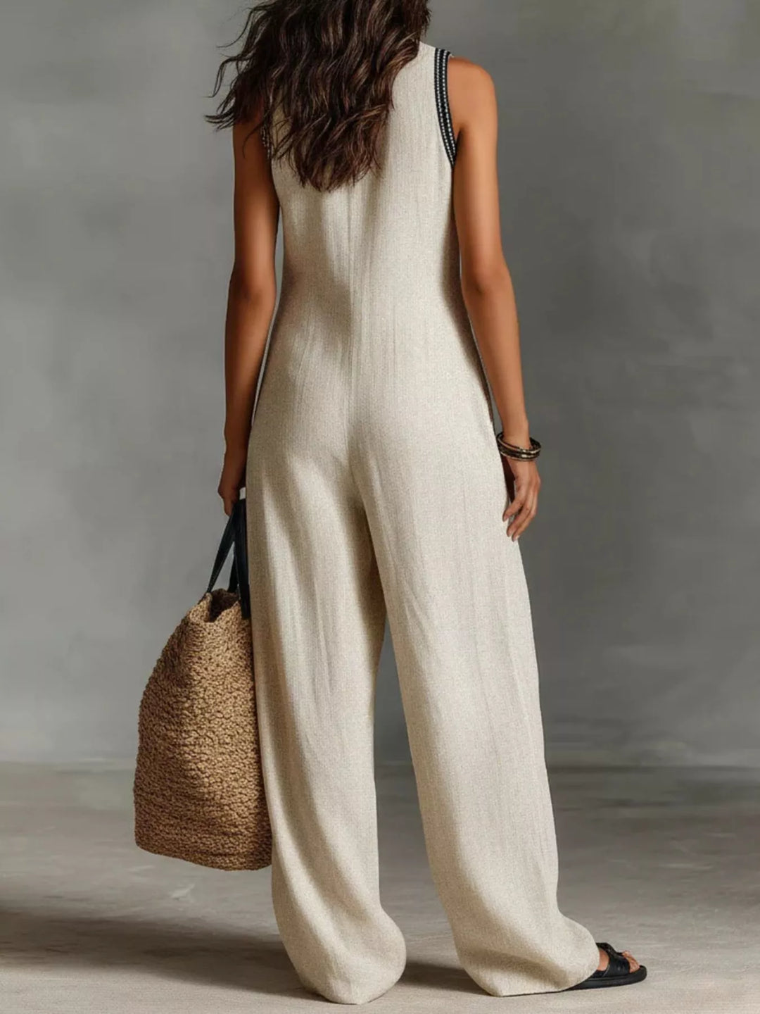 Ivory sleeveless wide-leg jumpsuit, back view with side pockets