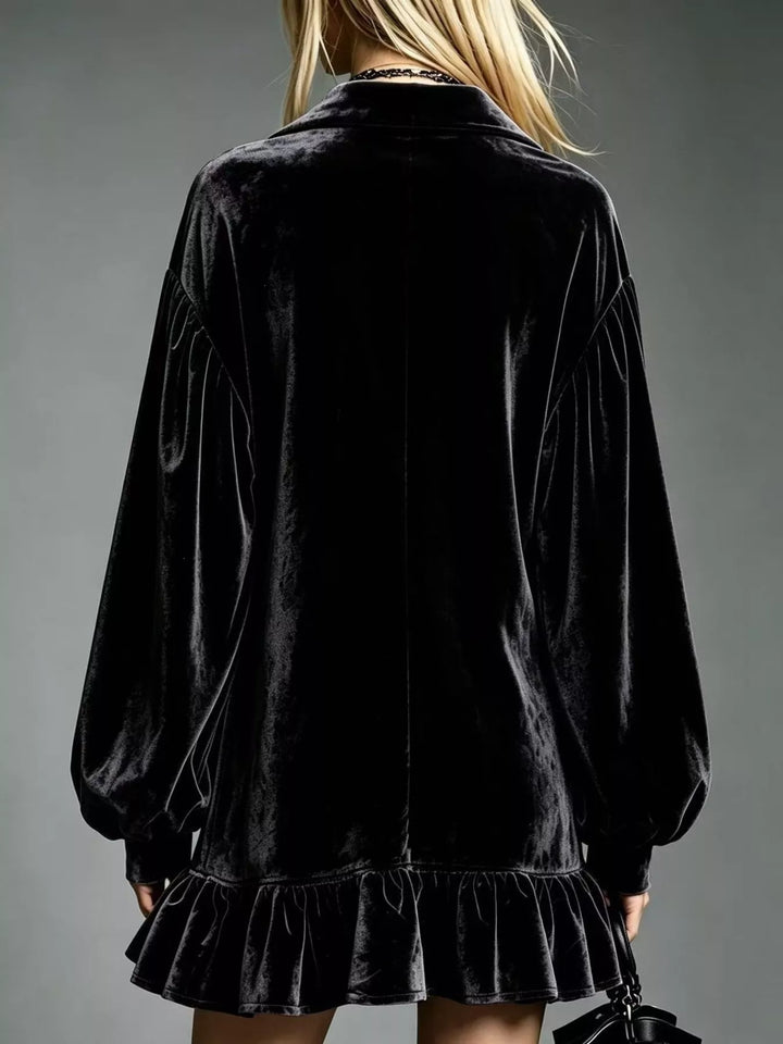 Black velvet long-sleeve mini dress, back view, with ruffle hem