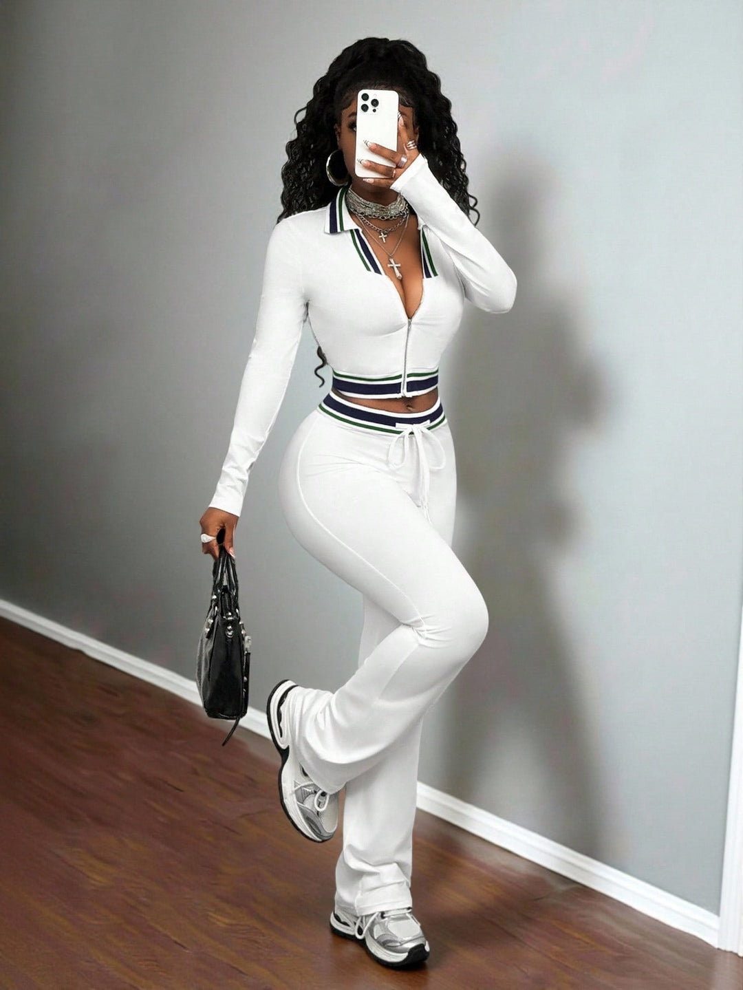 White women’s high-neck zip crop top and slim track pants set with ribbed collar