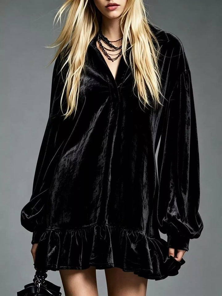 Black velvet long-sleeve mini dress with ruffle hem and V-neck