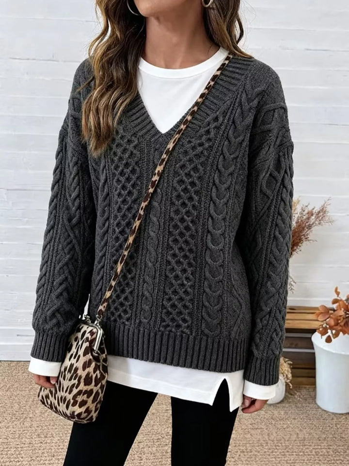 Charcoal gray cable-knit dropped-shoulder sweater with V-neck and ribbed hem