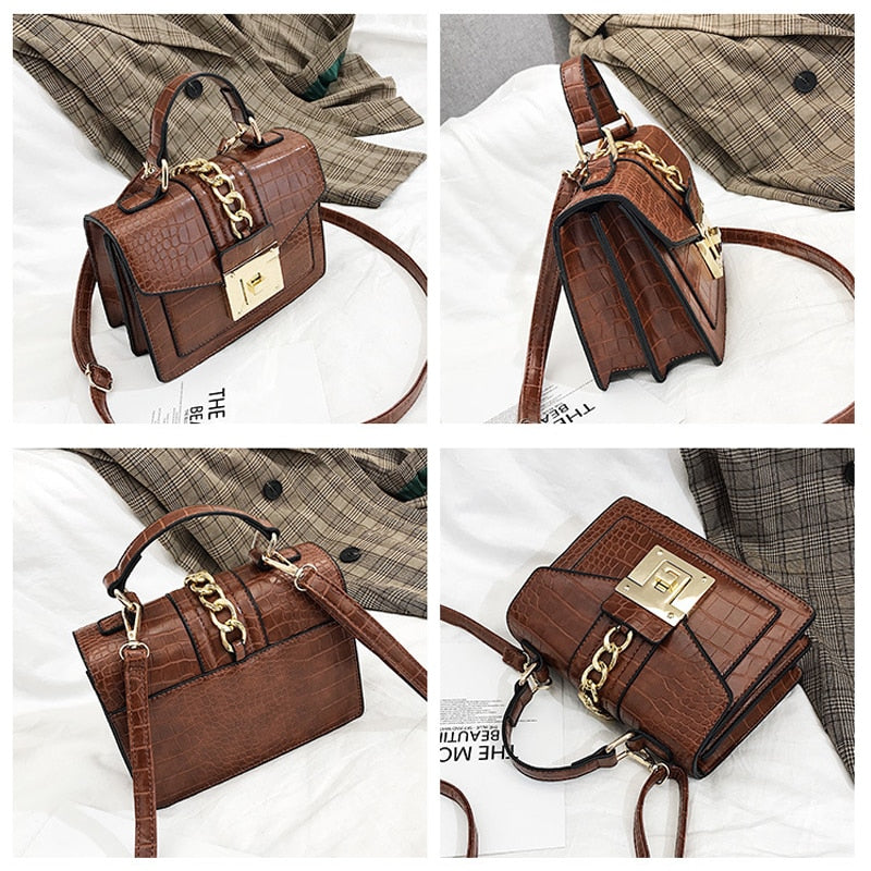 Brown crocodile-texture handbag with gold chain strap and front flap, gold turn-lock clasp