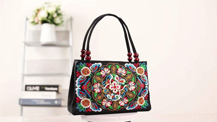 Handbag with floral embroidery on a light background