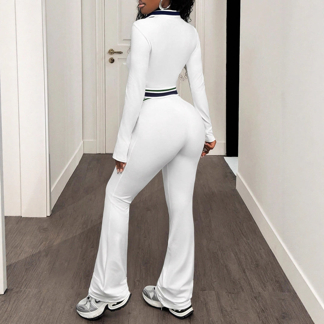 White women’s high-neck zip crop top and slim track pants set, full side view