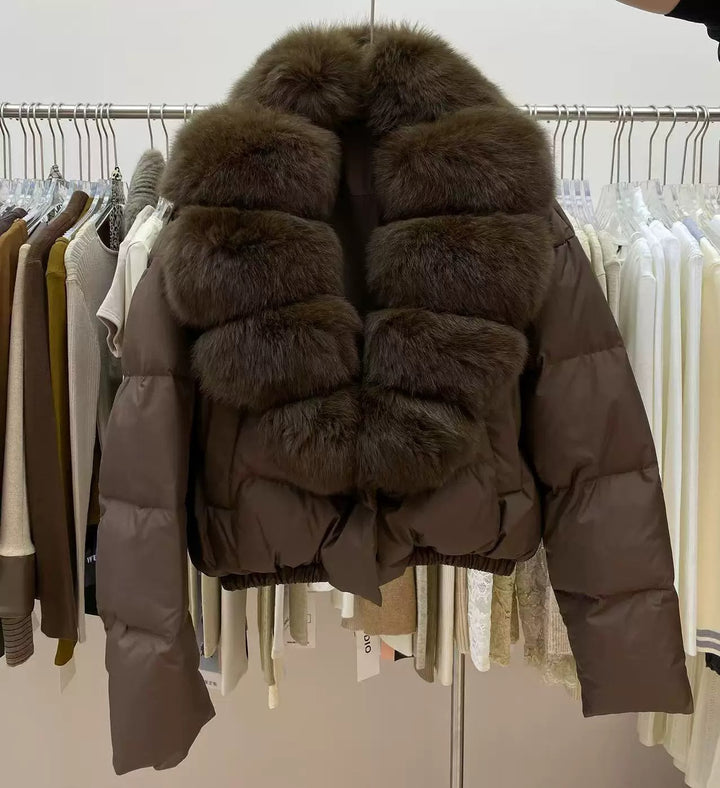 Close Front View Of Brown Women's Puffer Coat With Quilted Sleeves And Fur Collar