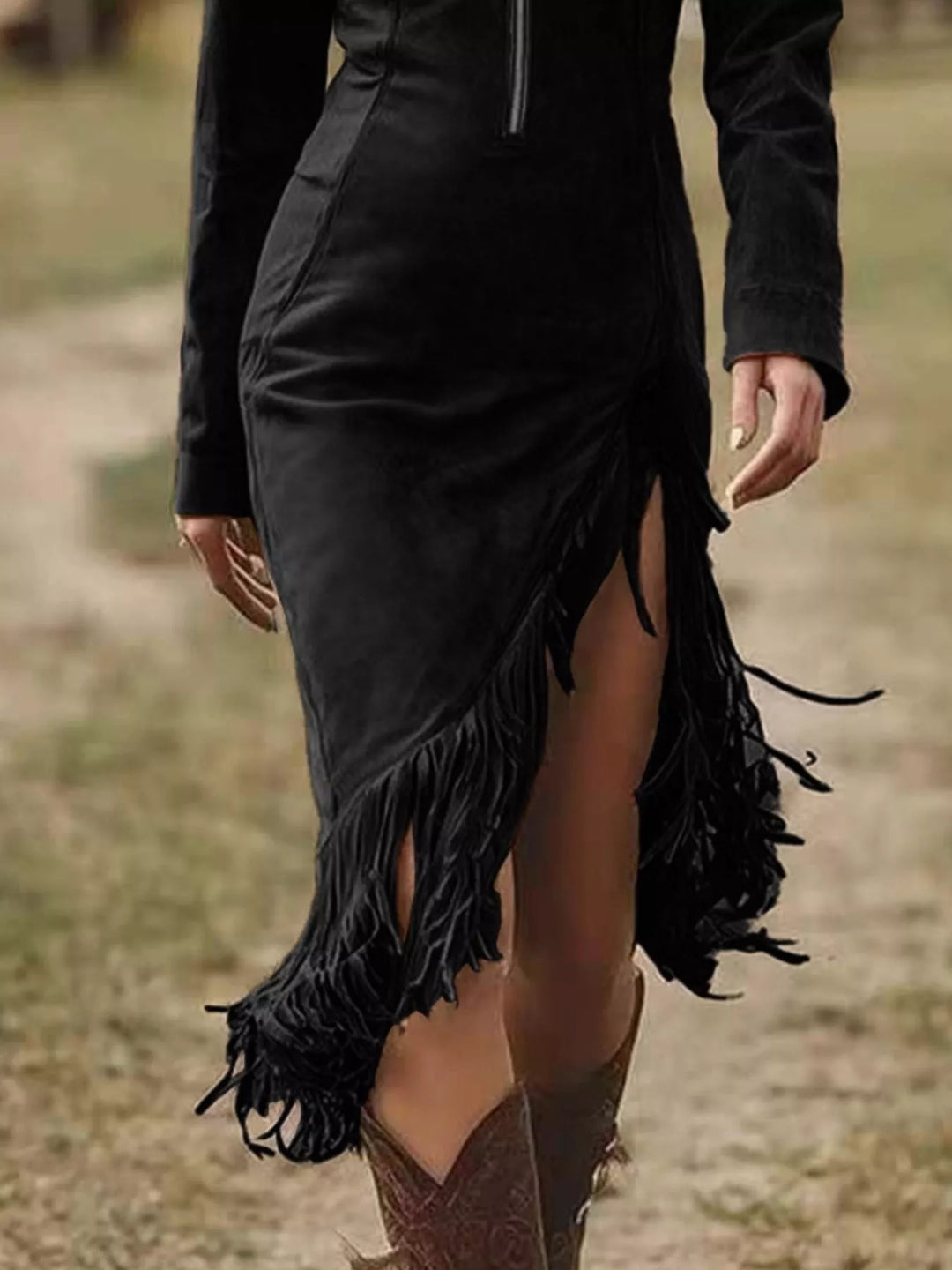 Black bodycon dress with zip front and uneven fringe hem