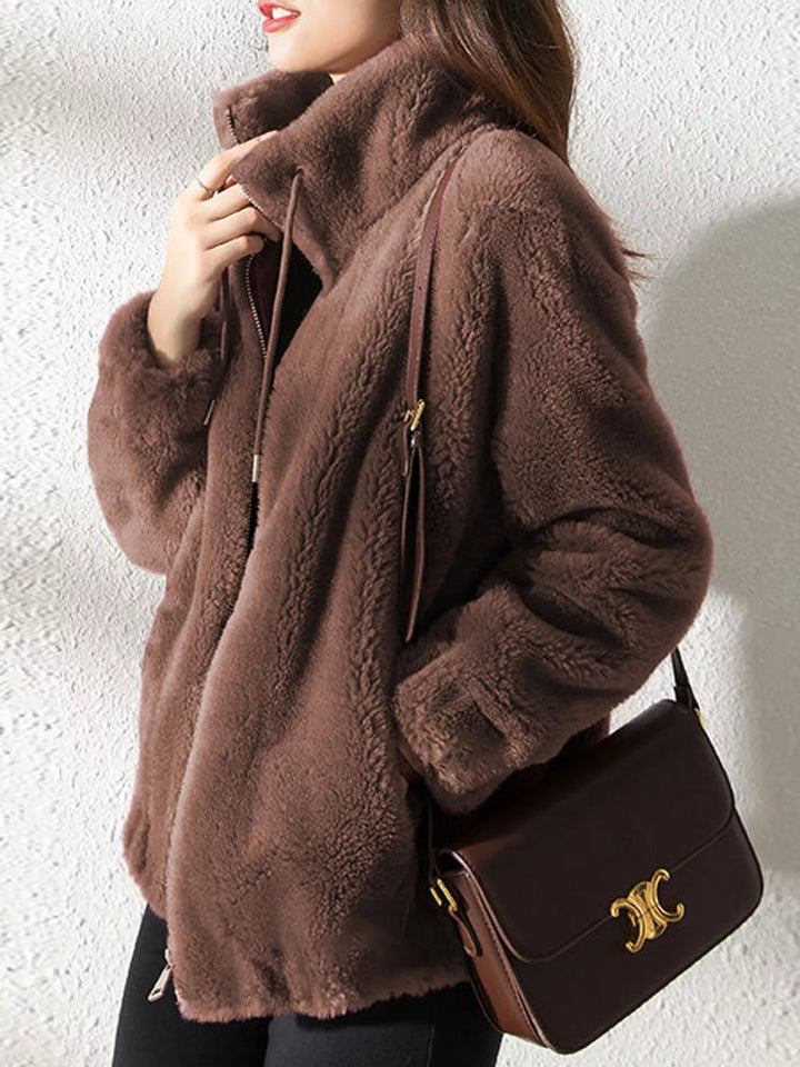 Dark brown faux fur zip jacket with stand collar and drawstring, side profile