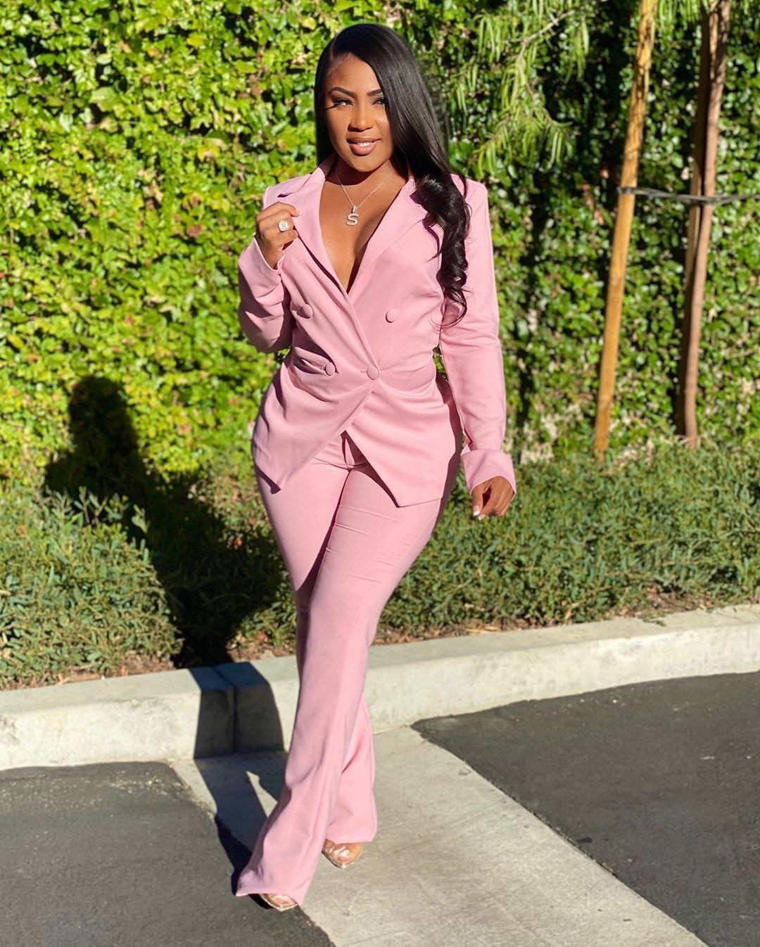 Woman wearing pink  office pants suit