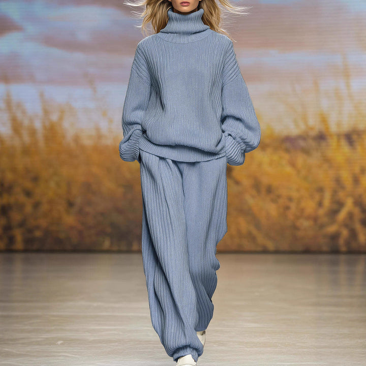 Blue ribbed knit two-piece set with high-neck top and wide-leg pants, long sleeves