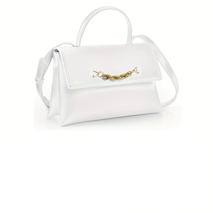 Set of four handbags in white, black, orange, and another color on a white background