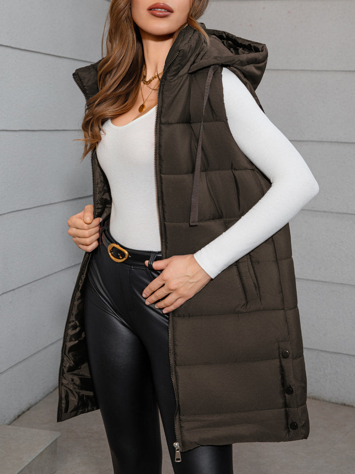 Dark brown long hooded puffer vest with sleeveless quilted panels, drawstring hood, front zipper