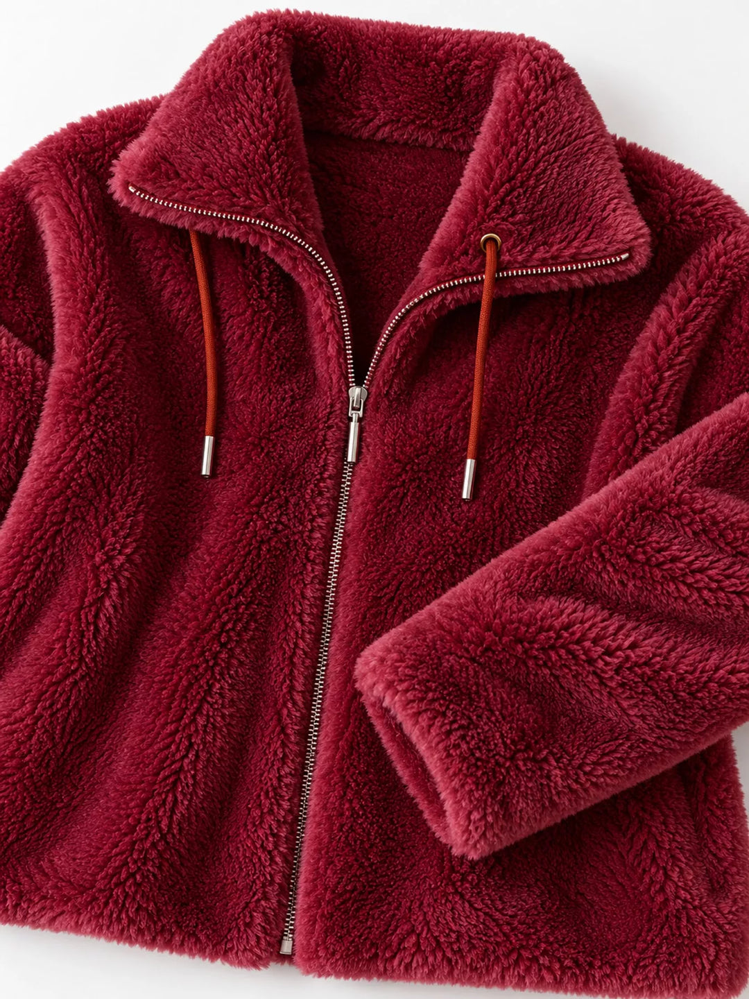 Burgundy faux fur zip jacket close-up: stand collar, zipper pull, drawstring ends