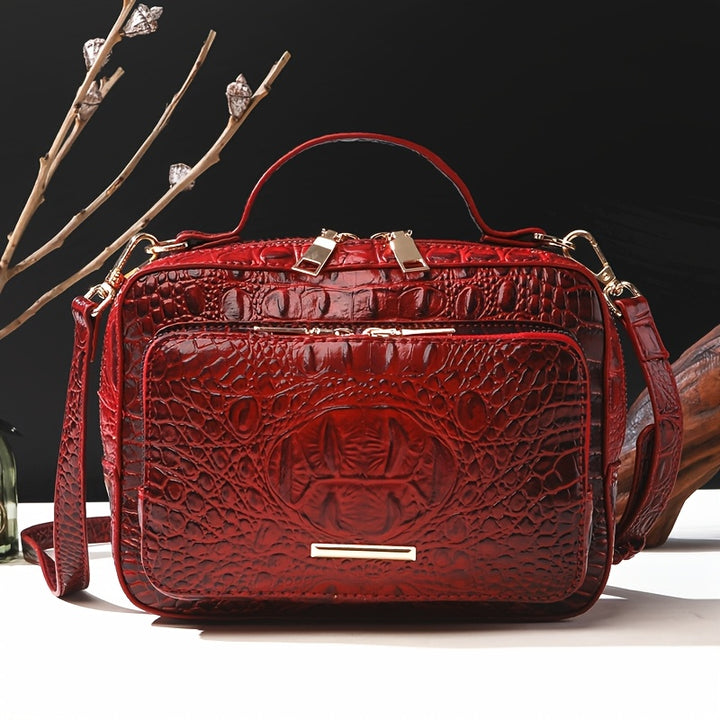 Red textured handbag with gold accents on a dark background