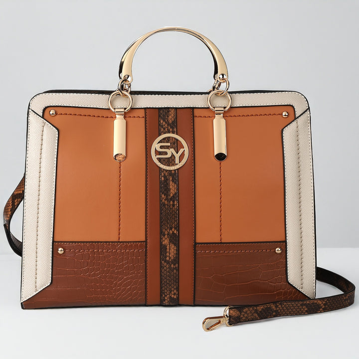 Multicolored handbag with a gold handle and strap on a light gray background