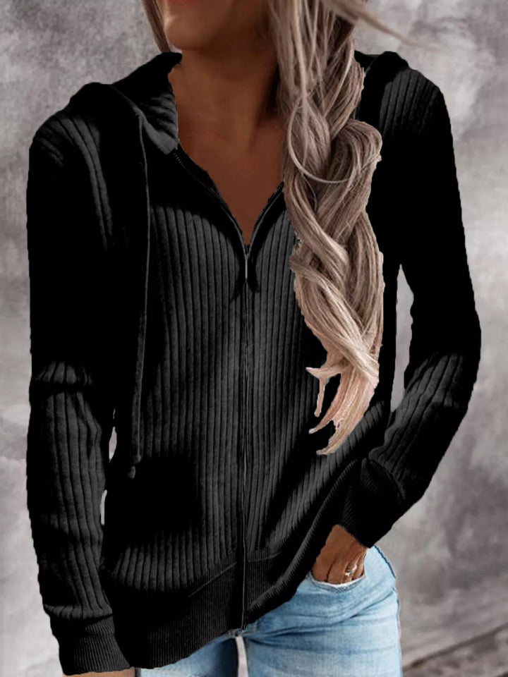 Women's Plus Size Black Ribbed Knit Zip-Up Hooded Cardigan, Front View With Jeans