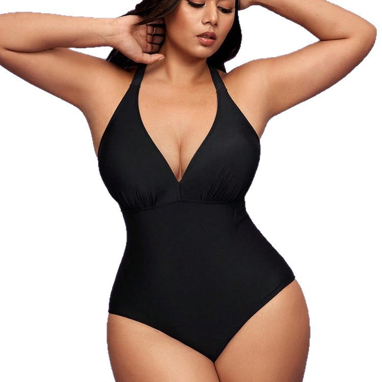 Black plus size one-piece swimsuit with deep V neckline and ruched bust