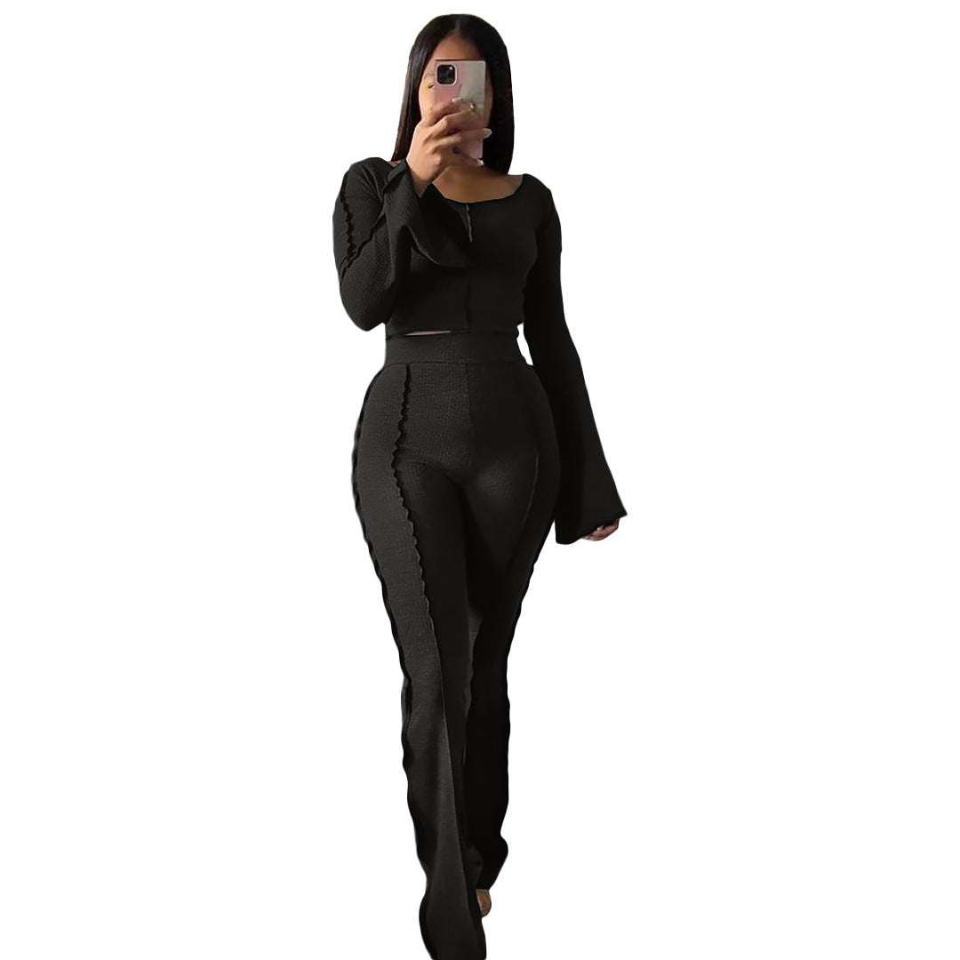 Woman in house wearing snug-fit black Yoga Sets