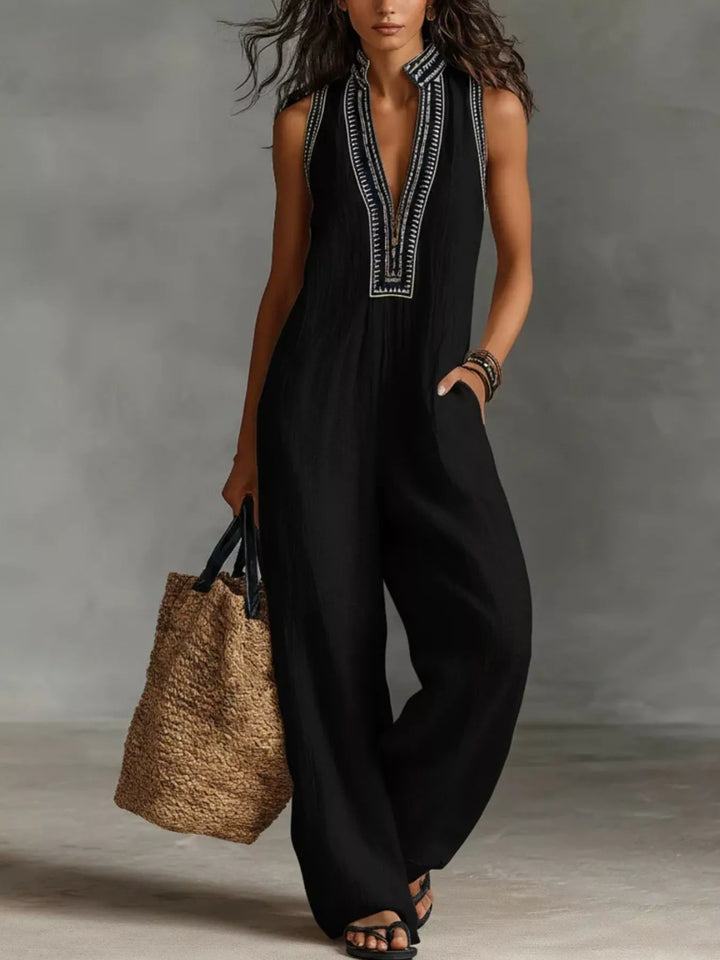 Black sleeveless wide-leg jumpsuit with embroidered V-neck placket