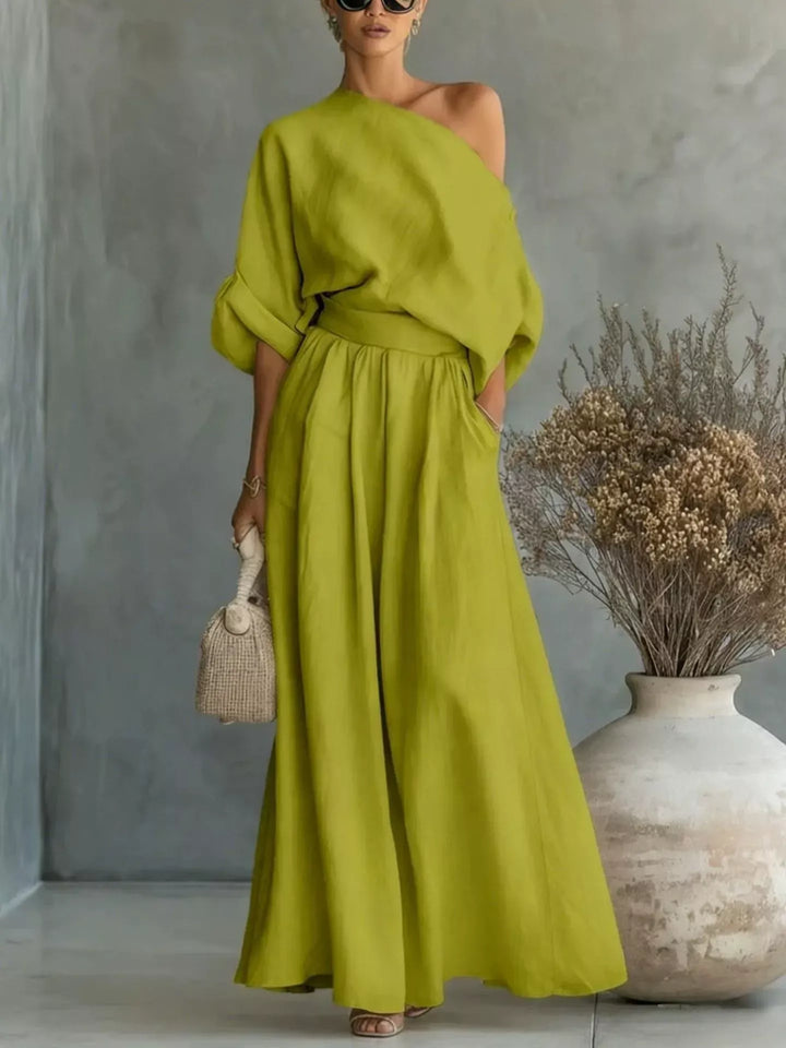 Lime green one-shoulder top and wide-leg pants set with draped sleeves and gathered waist