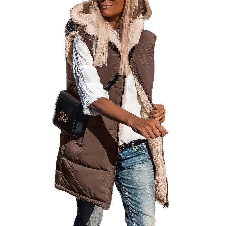 Reversible hooded puffer vest, brown outer with white fleece lining and front pockets