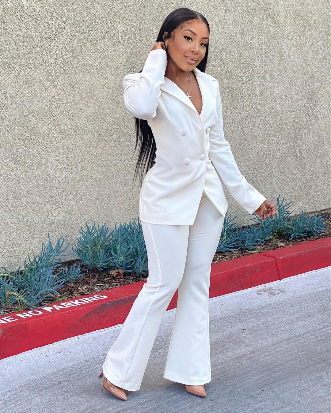 Woman wearing white office pants suit