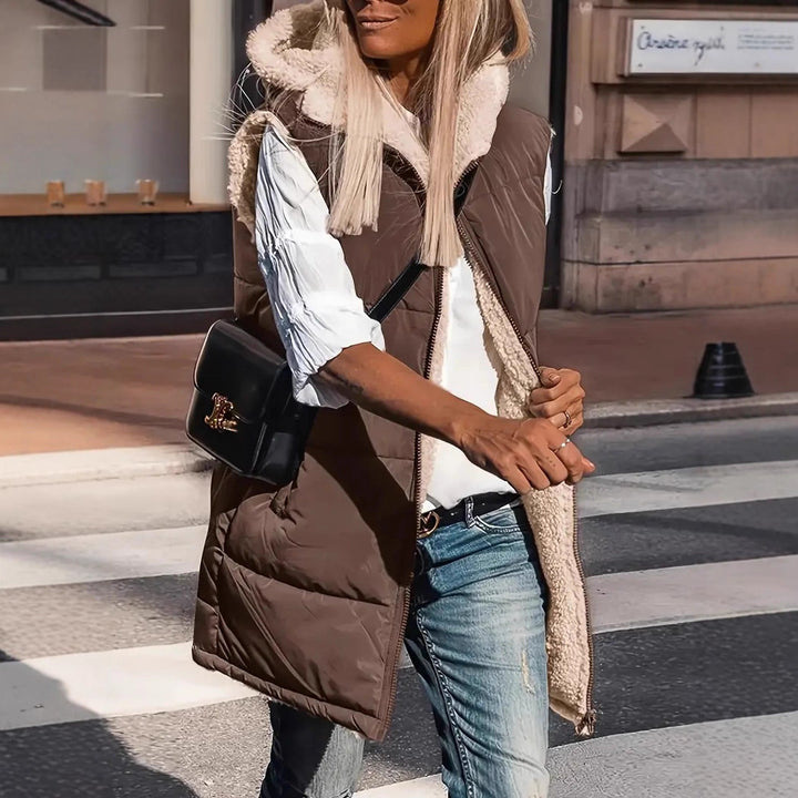 Reversible hooded puffer vest, brown with white fleece lining and front pockets