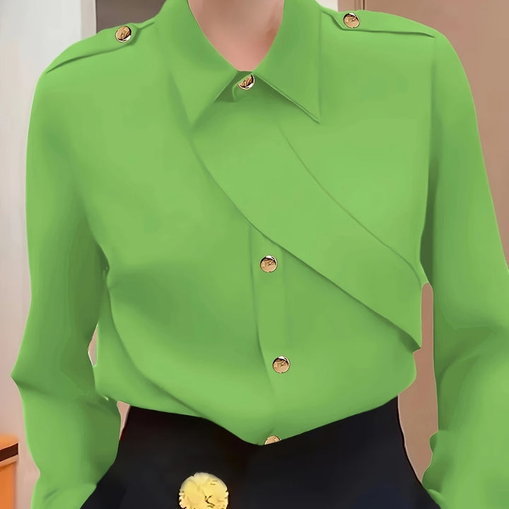 Green blouse with gold buttons on a mannequin against a neutral background