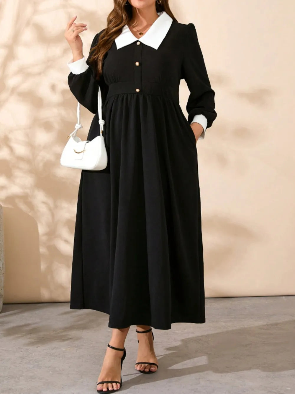 Black long-sleeve midi dress with contrast white collared neckline and button details