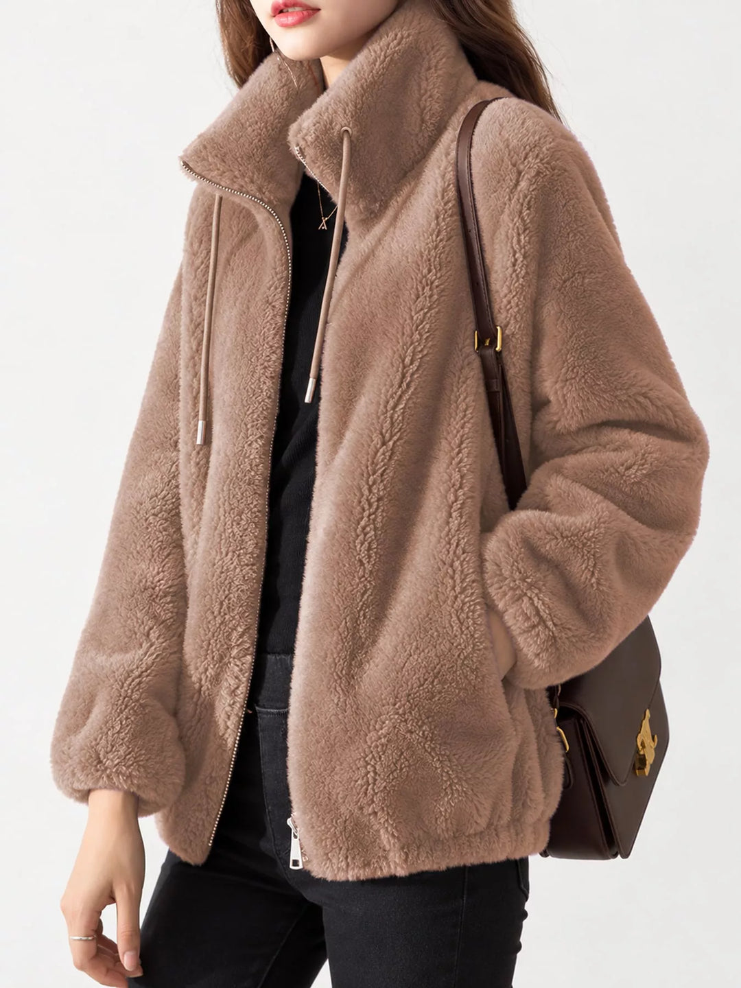 Taupe faux fur zip jacket with stand collar, drawstring cords, and zip pockets