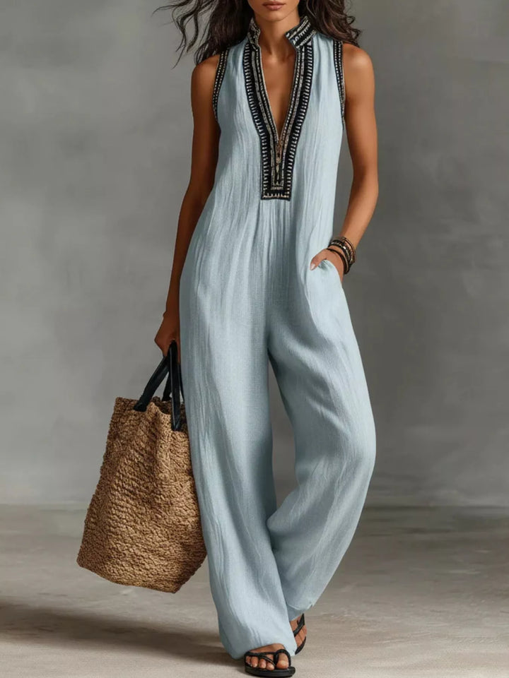 Sky blue sleeveless wide-leg jumpsuit with embroidered V-neck trim