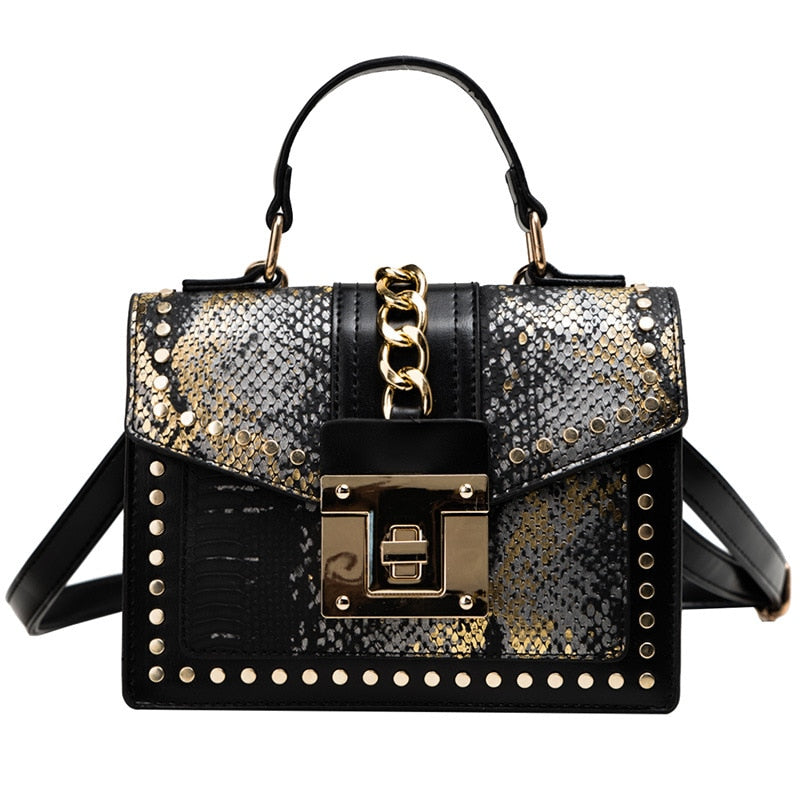 Alligator-texture handbag with chain strap, black and gold-speckled panels, gold studs