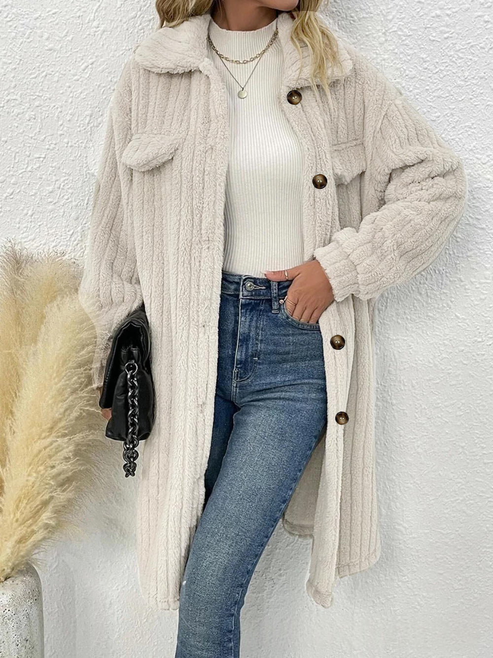 Front View Of Women’s Plus Size White Plush-Textured Coat Worn Open Over A White Top And Blue Jeans
