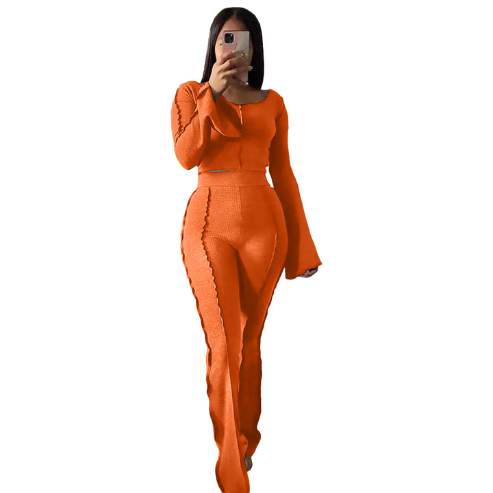 Woman in house wearing snug-fit orange Yoga Sets
