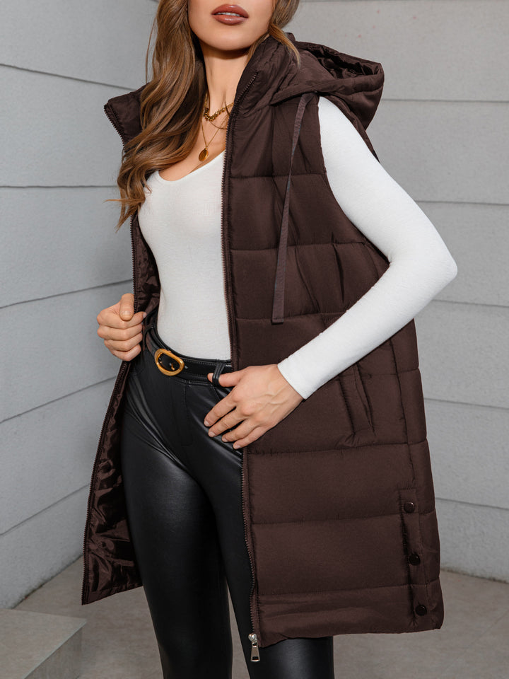 Women's long hooded puffer vest in dark brown, sleeveless with front zipper and drawstring