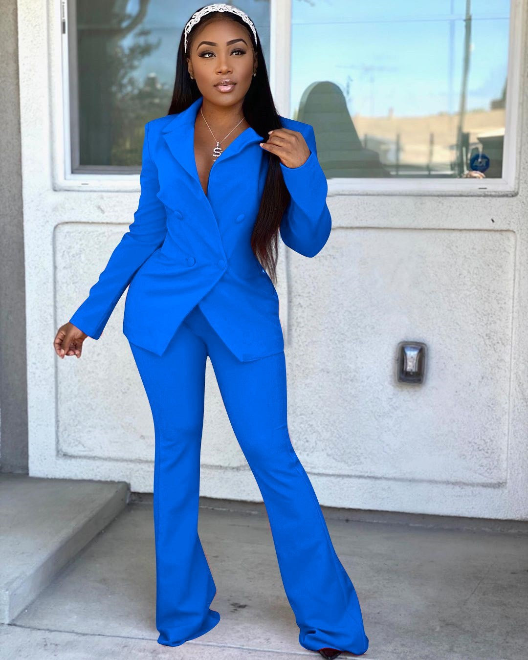 Woman wearing blue office pants suit