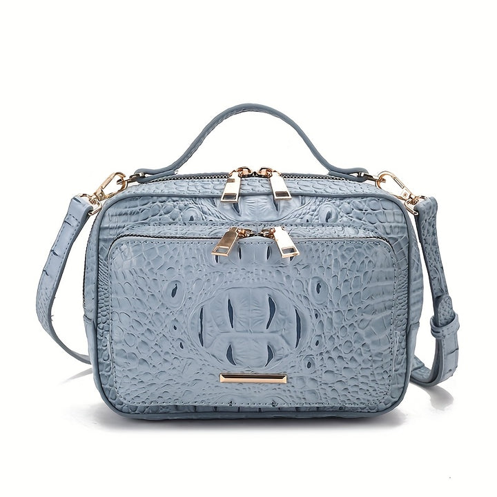 Light blue textured handbag with gold accents on a white background
