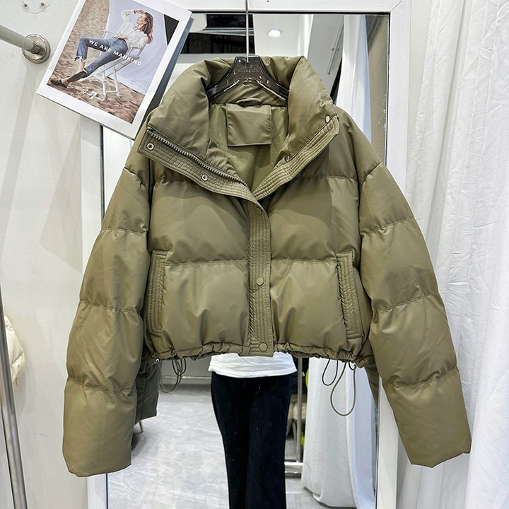 Olive green women's puffer down coat with high neck, front zip and snap buttons