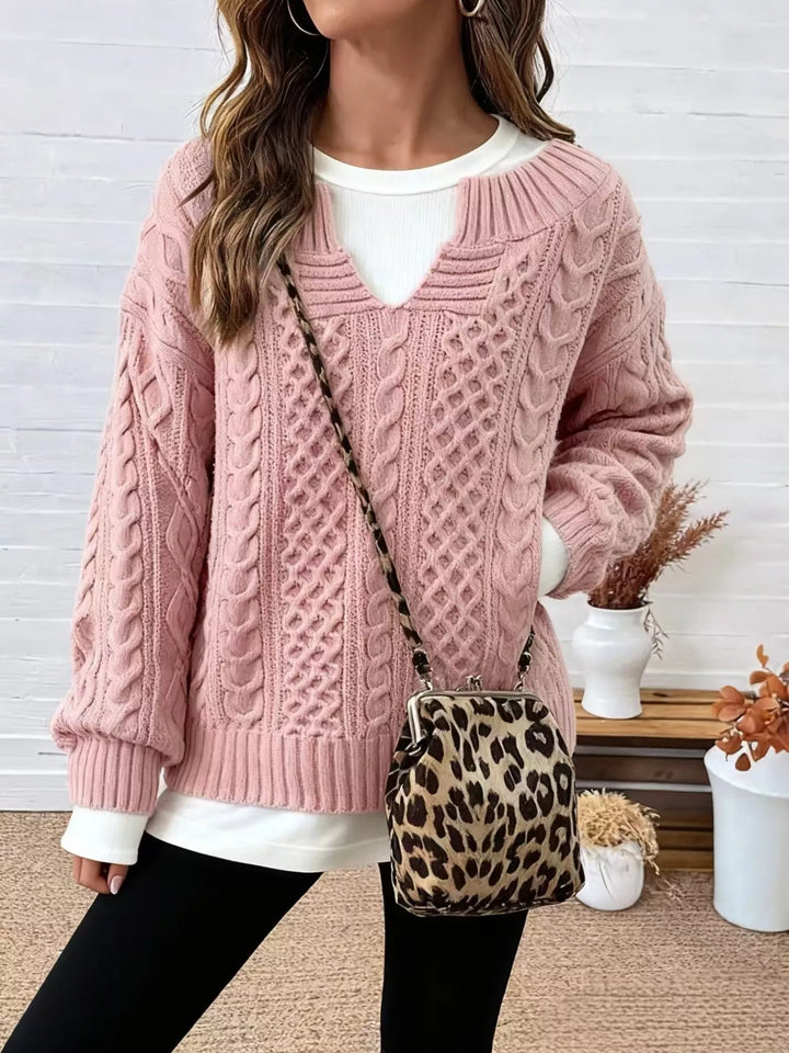 Dusty pink cable-knit dropped-shoulder sweater with V-neck and ribbed cuffs