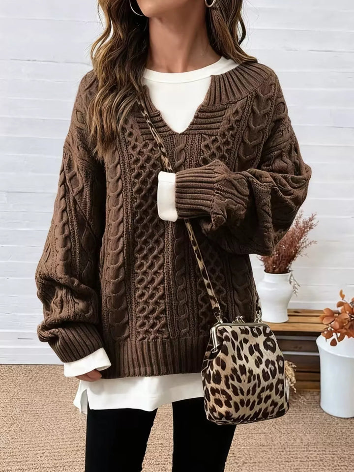 Brown cable-knit dropped-shoulder sweater with V-neck and ribbed cuffs