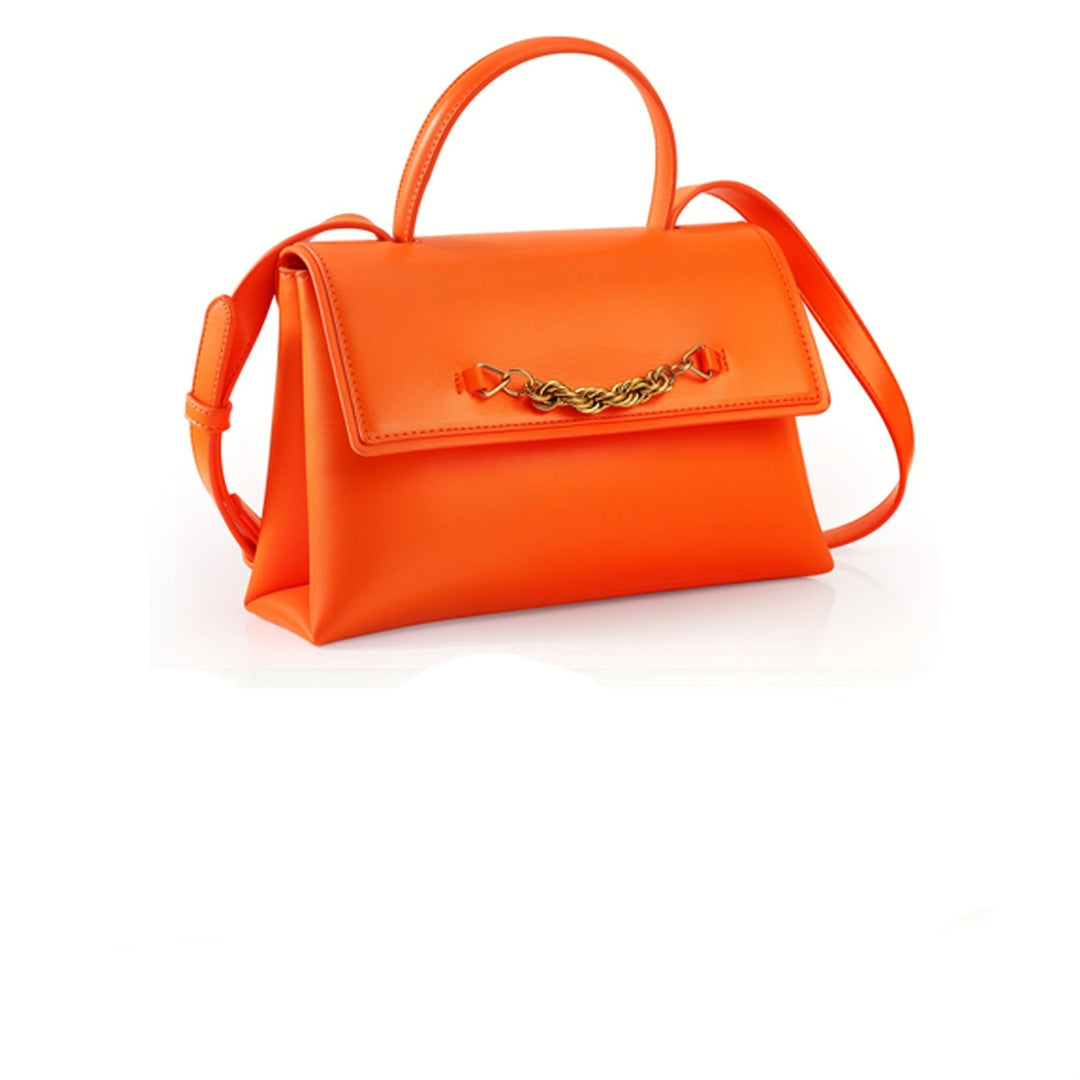 Orange handbag with gold chain detail on a white background