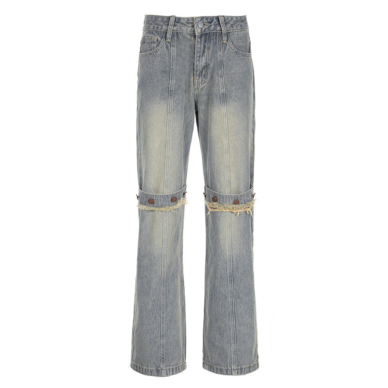 Light blue jeans with distressed details on a white background