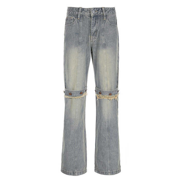 Light blue jeans with distressed details on a white background