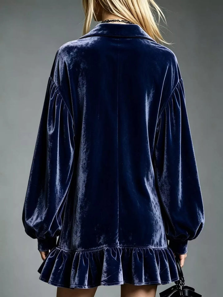 Dark blue velvet long-sleeve mini dress back view with ruffle hem and puff sleeves